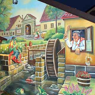 Malba na zdi zahradního domlu s vodníkem